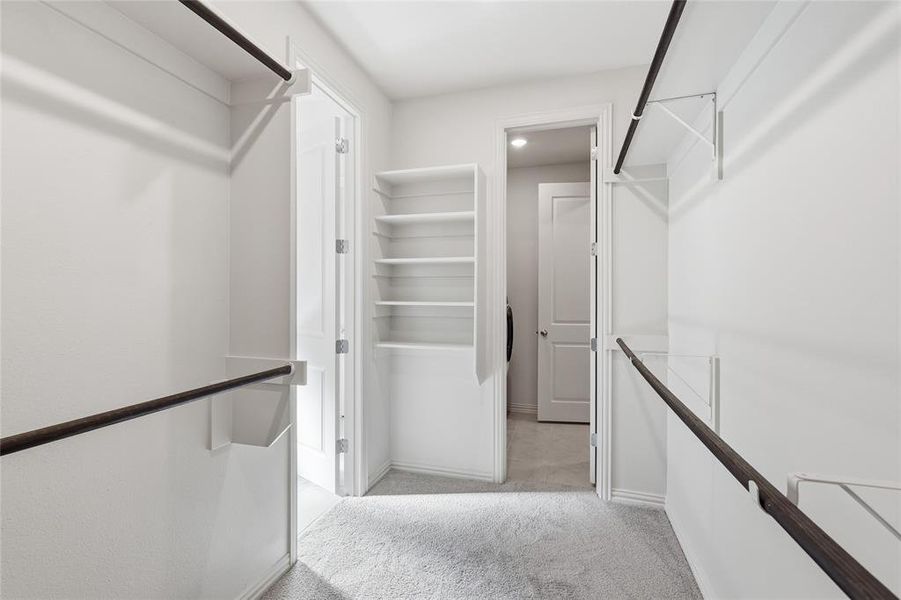 Walk in closet with light carpet Walk in closet with light carpet