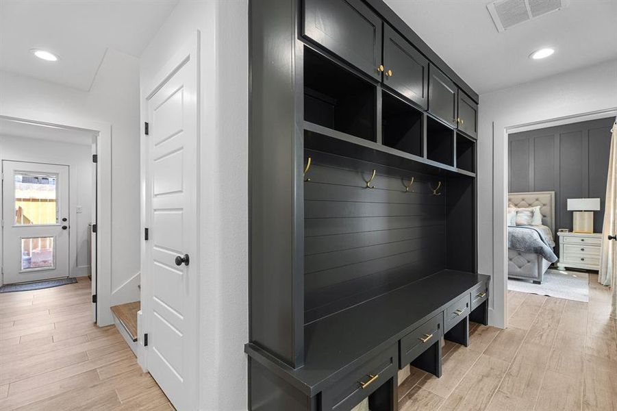 Mudroom with recessed lighting, light wood-type flooring, and visible vents Mudroom with recessed lighting, light wood-type flooring, and visible vents