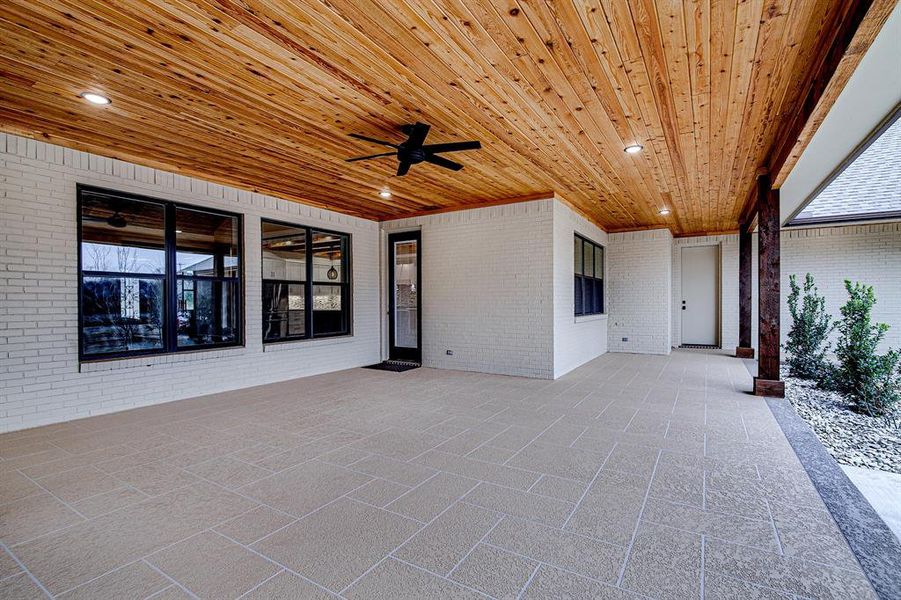 View of covered back patio with half bath and garage access View of covered back patio with half bath and garage access