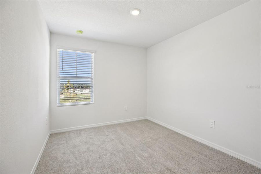 Spacious, unfurnished interior of a new home in The Reserve at Hammock Oaks Townes, Lady Lake (Image 25).