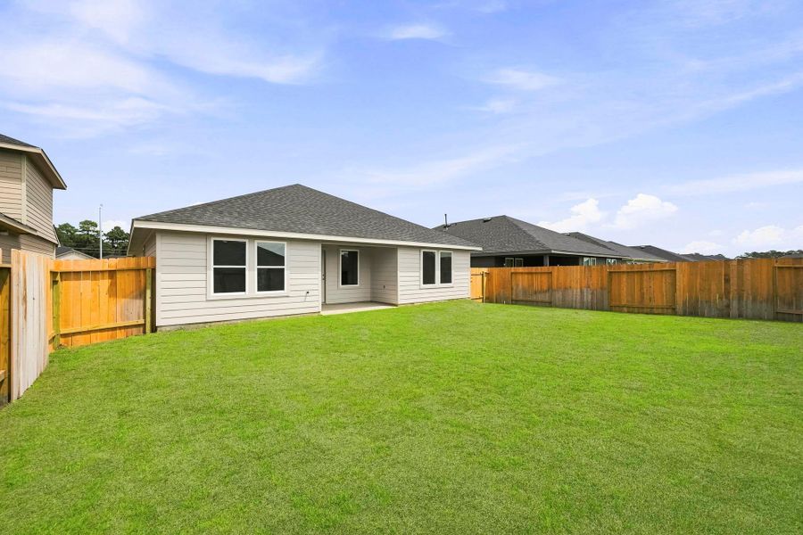 Exterior details and patio area of a home in Grand Pines, Magnolia (Image 17).