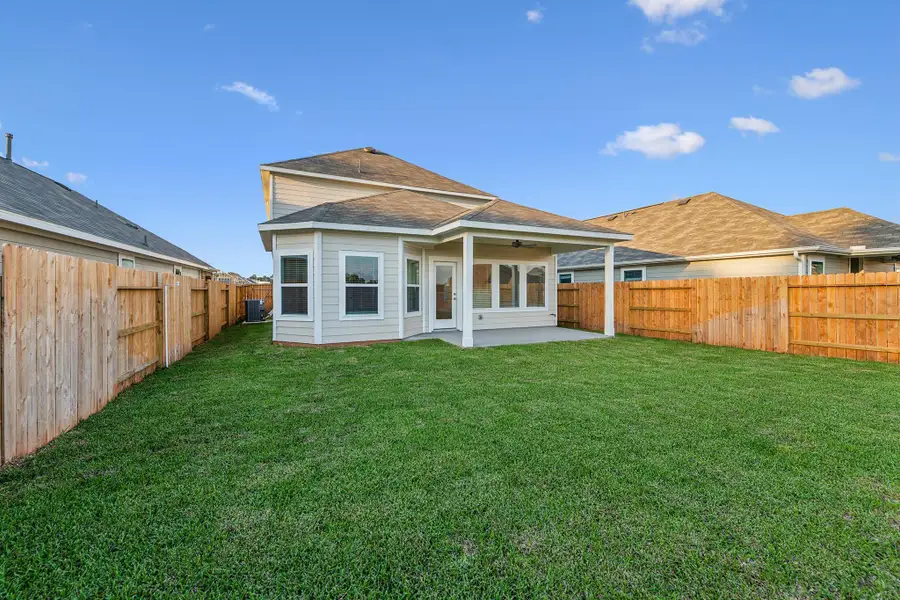Exterior details and patio area of a home in Lone Star Landing, Montgomery (Image 2). Exterior details and patio area of a home in Lone Star Landing, Montgomery (Image 2).