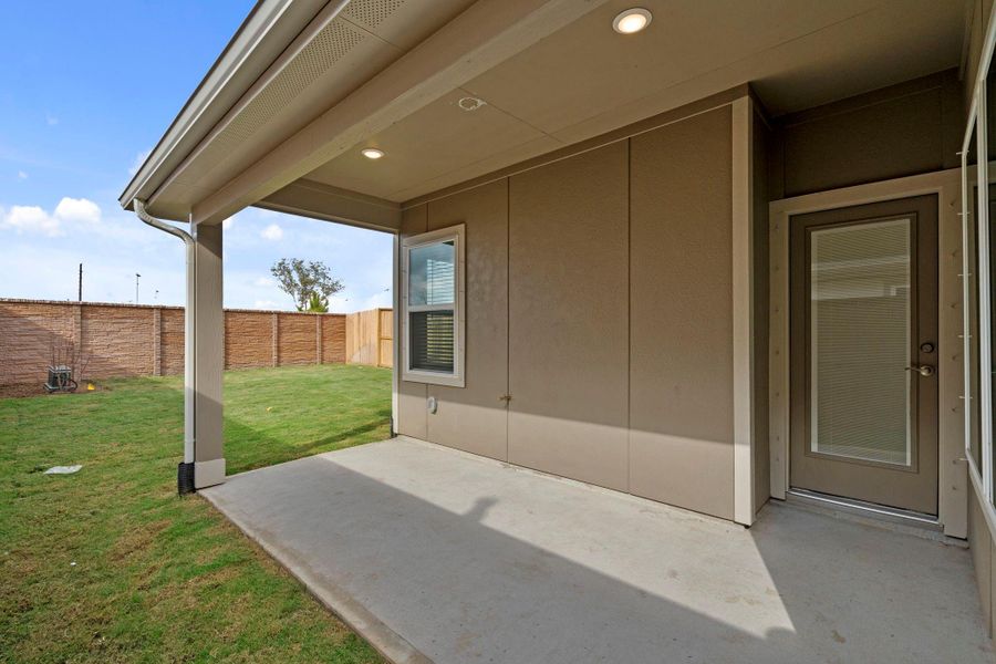 Exterior details and patio area of a home in Meridiana, Iowa Colony (Image 3).