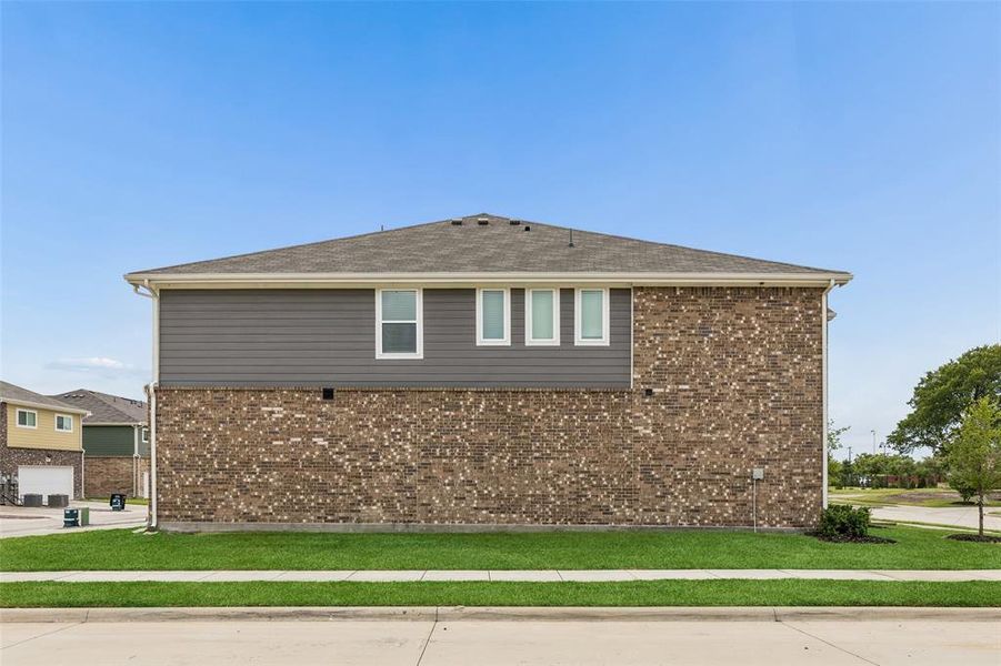 Front exterior of a new home in Cloverleaf Crossing Townhomes, Mesquite, TX, highlighting curb appeal (Image 21).