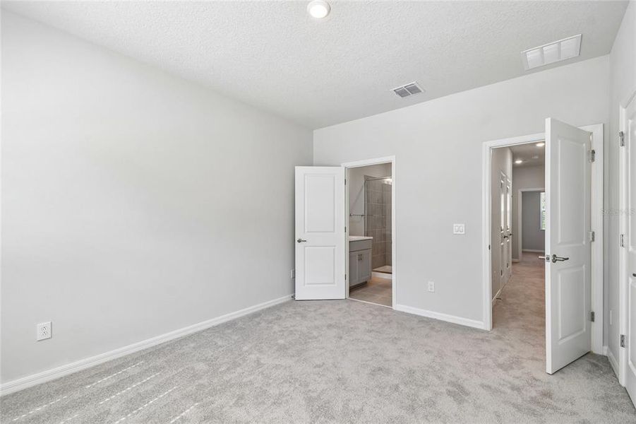 Spacious, unfurnished interior of a new home in Preserve at The Cays – The Driftwood Series, Daytona Beach (Image 21). Spacious, unfurnished interior of a new home in Preserve at The Cays – The Driftwood Series, Daytona Beach (Image 21).
