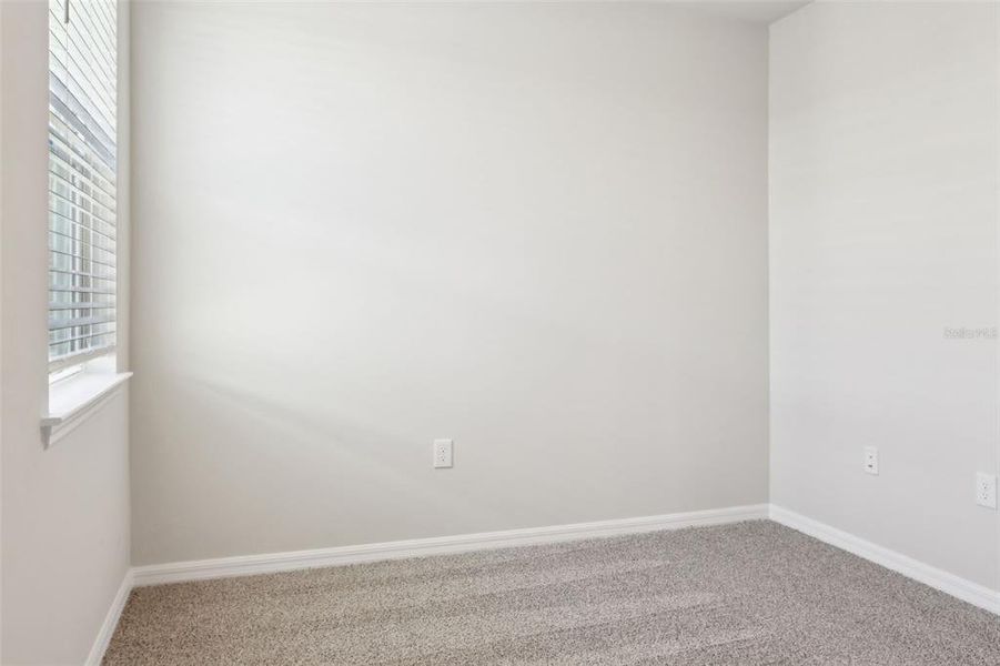 Spacious, unfurnished interior of a new home in Crescent Lakes - Premier Series, Punta Gorda (Image 17).