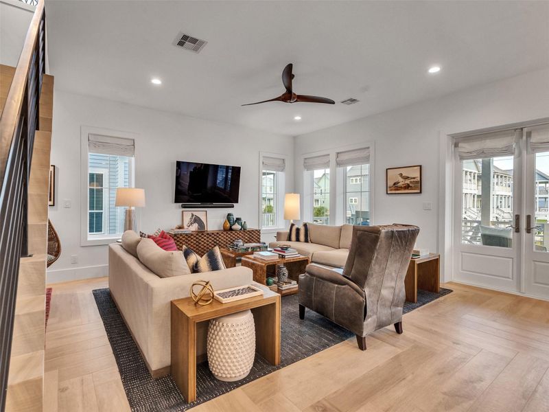 This bright, open living space flows right to the porch — perfect for soaking in Gulf breezes or hosting friends after a beach day. Filled with natural light and coastal charm, it’s where every day feels like vacation! This bright, open living space flows right to the porch — perfect for soaking in Gulf breezes or hosting friends after a beach day. Filled with natural light and coastal charm, it’s where every day feels like vacation!