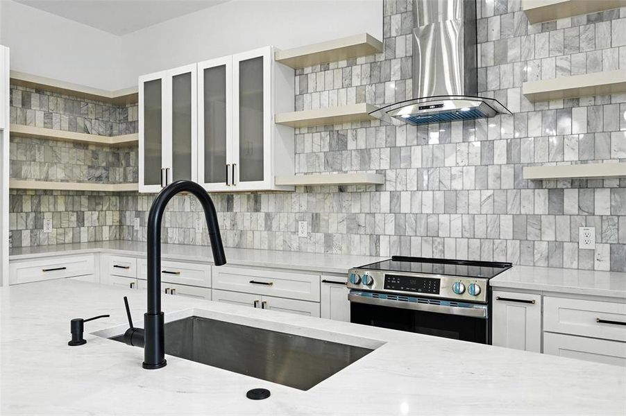 Kitchen featuring open shelves, stainless steel electric range, and range hood Kitchen featuring open shelves, stainless steel electric range, and range hood