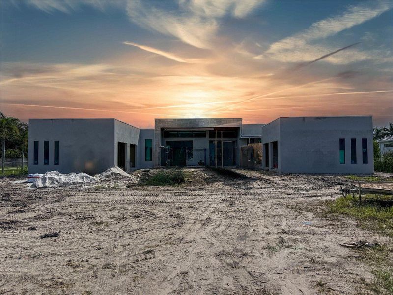 STUCCO ALMOST COMPLETE.