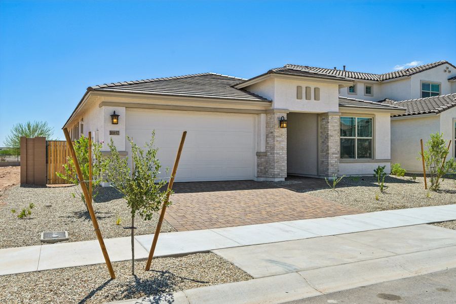 Representative exterior photo of a completed home built from the Essence by Taylor Morrison in Artisan at Asante, Surprise, AZ (Image 23). Representative exterior photo of a completed home built from the Essence by Taylor Morrison in Artisan at Asante, Surprise, AZ (Image 23).