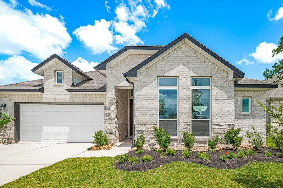 Front exterior of a new home in Lago Mar, La Marque, TX, highlighting curb appeal (Image 1).