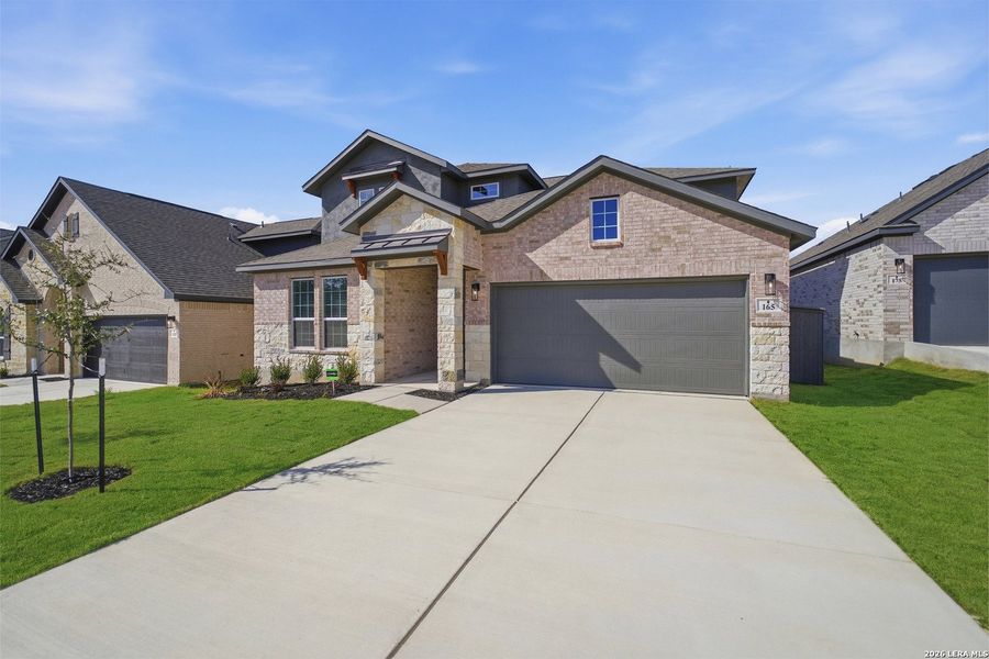 Front exterior of a new home in The Woodlands at Medina Hills, Mico, TX, highlighting curb appeal (Image 20).