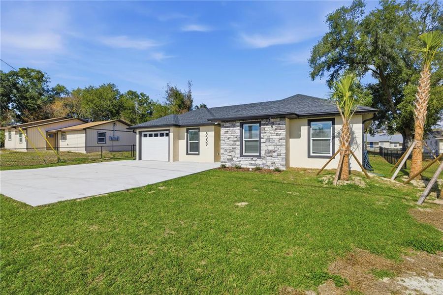 Front exterior of a new home in , Ocala, FL, highlighting curb appeal (Image 22).