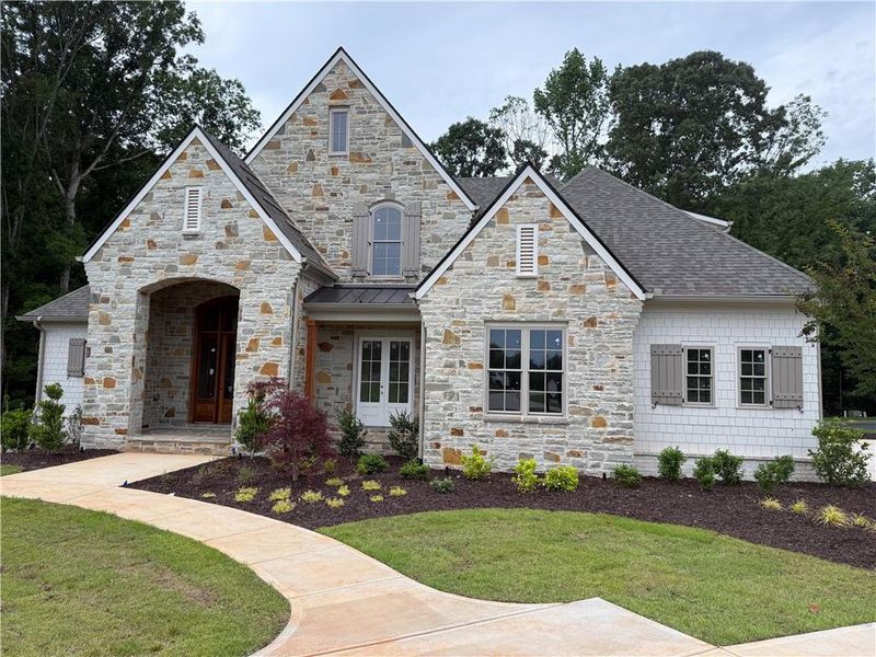 Front exterior of a new home in , Flowery Branch, GA, highlighting curb appeal (Image 6).