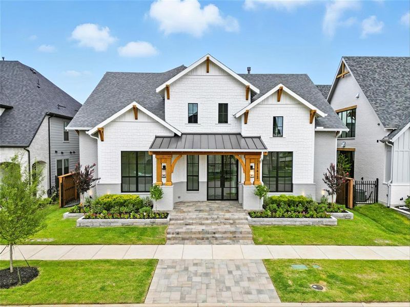 Front exterior of a new home in Fields, Frisco, TX, highlighting curb appeal (Image 23).