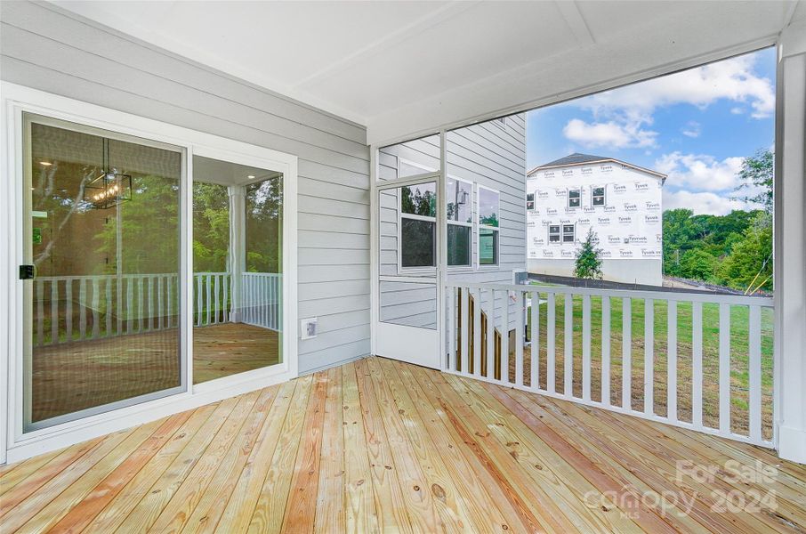 Covered back deck off breakfast room