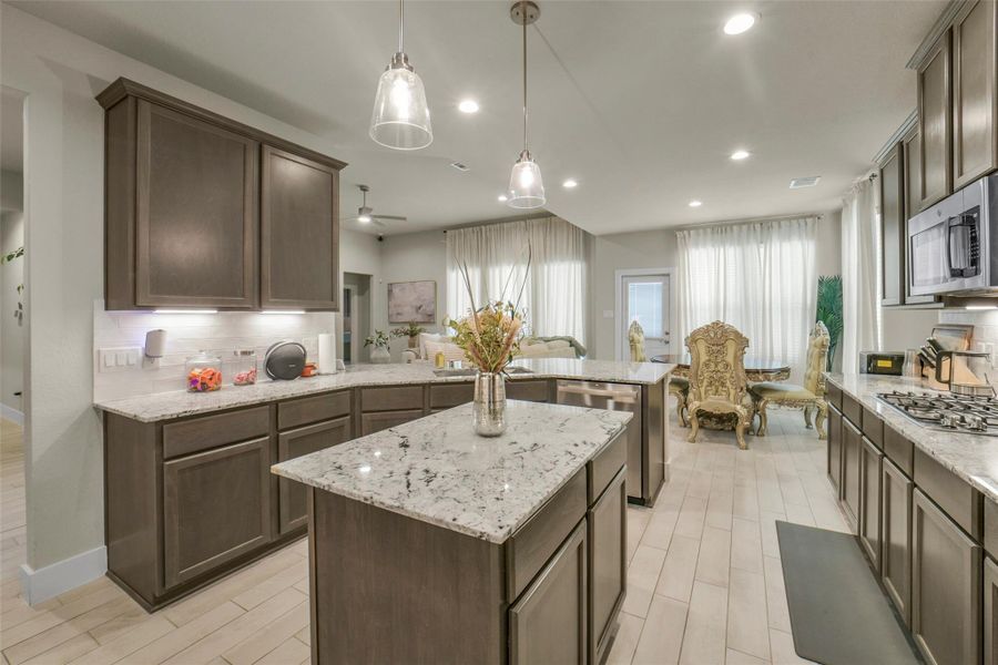 Kitchen opens directly to the family room for effortless entertaining.