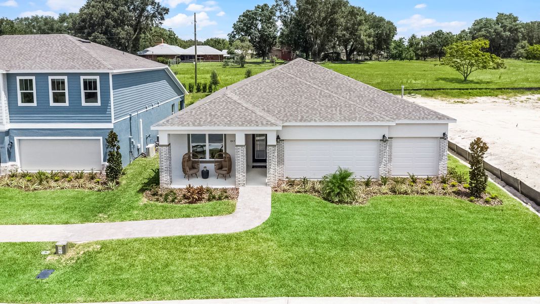 Representative exterior photo of a completed home built from the Everly by Hartizen Homes in Eden Crest, Apopka, FL (Image 26).
