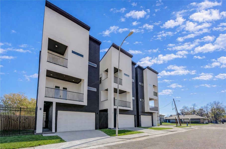Welcome to San Juan Vistas. Modern three story home with a sleek design, and featuring two balconies. Ideal for contemporary urban living.