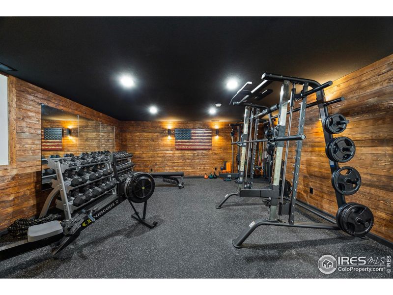 beautifully wood wrapped walls in basement living area
