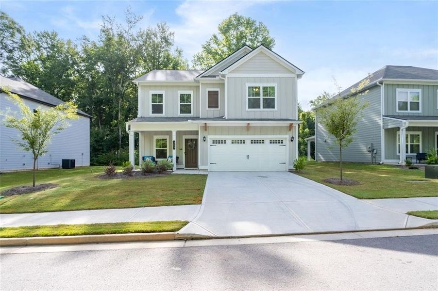 Front exterior of a new home in Morgan Landing, Carrollton, GA, highlighting curb appeal (Image 28). Front exterior of a new home in Morgan Landing, Carrollton, GA, highlighting curb appeal (Image 28).