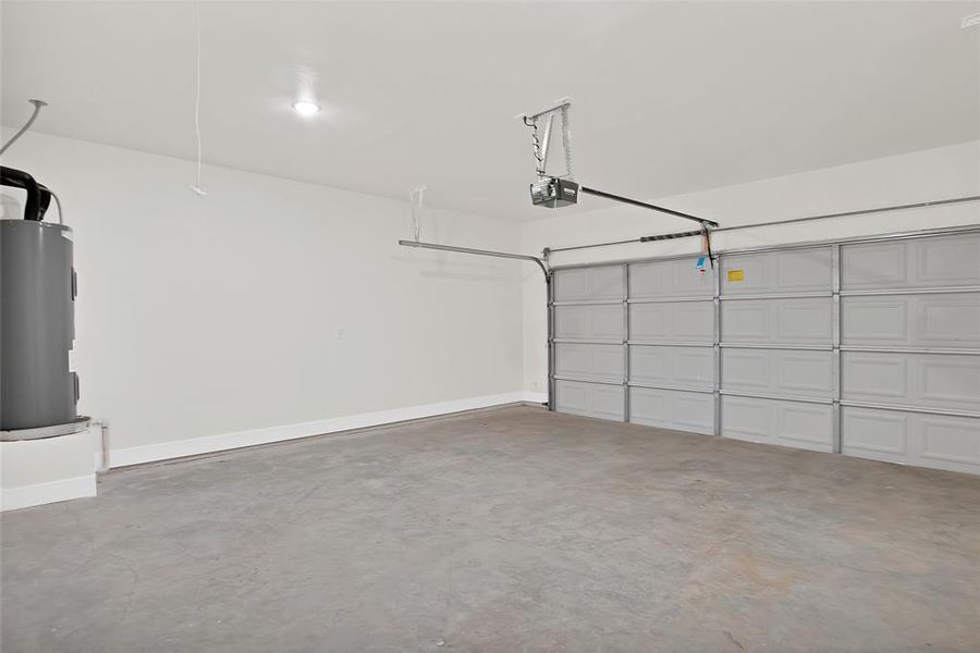 Garage with water heater and a garage door opener