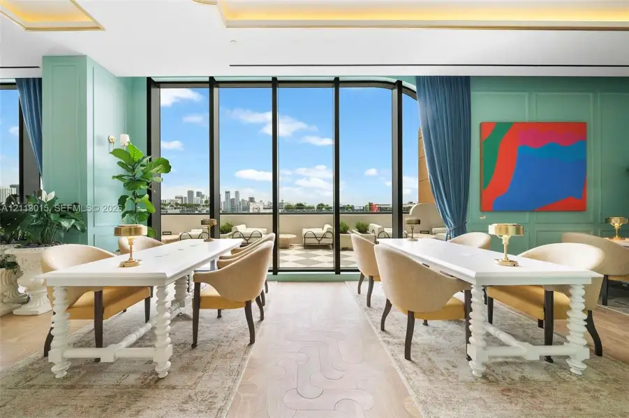Floor-to-ceiling windows, wood-finish flooring with geometric inlay, recessed ceiling lighting, and terrace access