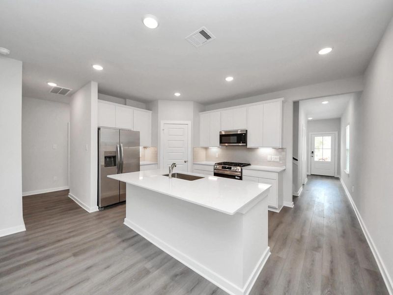 Furnished interior view inside a new home in Caney Creek Place, Conroe (Image 7).