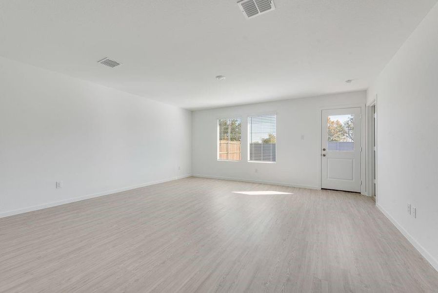 Empty room featuring light wood-type flooring