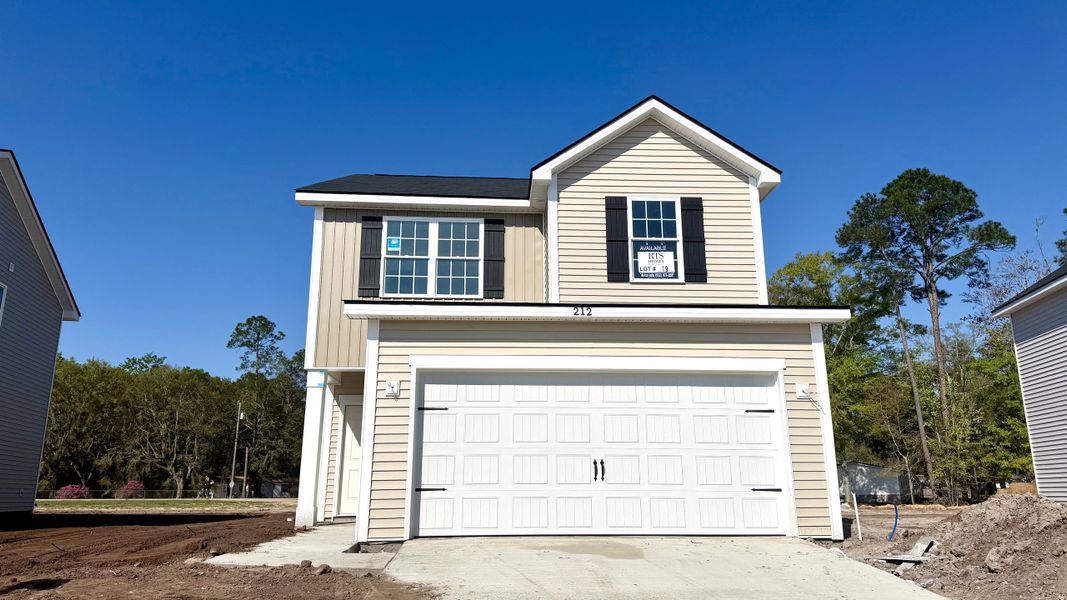 Front exterior of a new home in Grand Reserve, Hinesville, GA, highlighting curb appeal (Image 1). Front exterior of a new home in Grand Reserve, Hinesville, GA, highlighting curb appeal (Image 1).