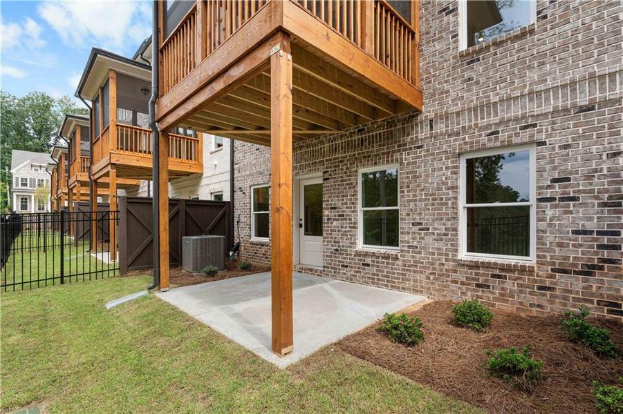 Front exterior of a new home in Ward's Crossing Townhomes, Johns Creek, GA, highlighting curb appeal (Image 23).