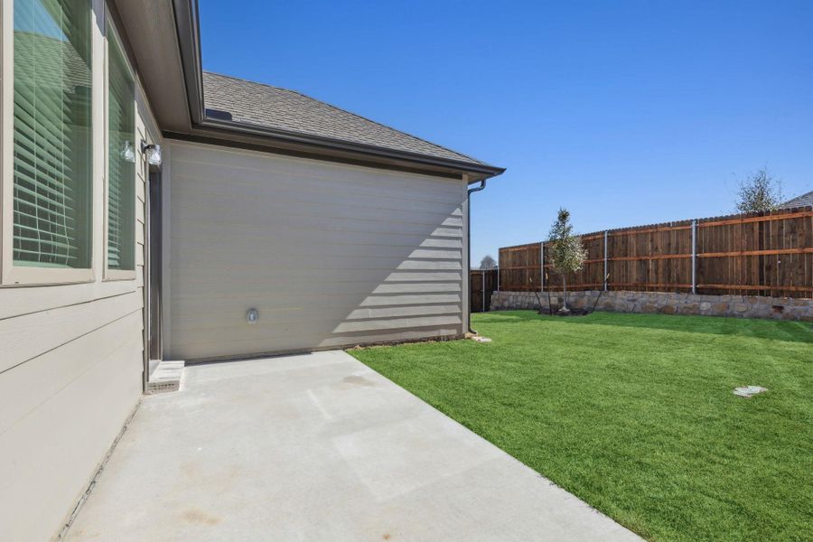 Exterior details and patio area of a home in Trinity Ranch, Elgin (Image 3). Exterior details and patio area of a home in Trinity Ranch, Elgin (Image 3).