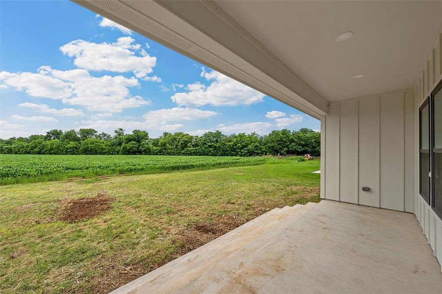 Expansive covered patio featuring a concrete surface and recessed lighting