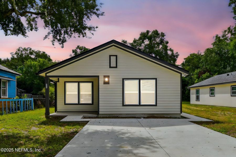 Front exterior of a new home in , Jacksonville, FL, highlighting curb appeal (Image 1).