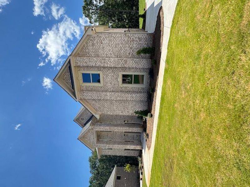 Front exterior of a new home in Underwood Crossing, Covington, GA, highlighting curb appeal (Image 2).