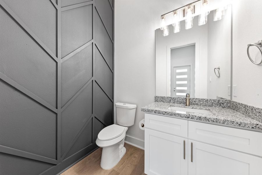 Clean and modern downstairs bathroom with sleek fixtures and a bright, fresh design. Clean and modern downstairs bathroom with sleek fixtures and a bright, fresh design.