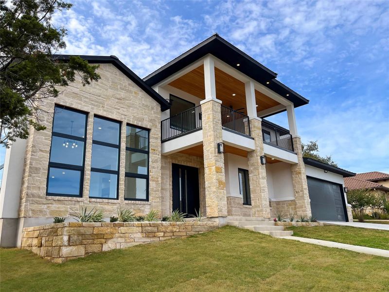 Front exterior of a new home in , Horseshoe Bay, TX, highlighting curb appeal (Image 16). Front exterior of a new home in , Horseshoe Bay, TX, highlighting curb appeal (Image 16).