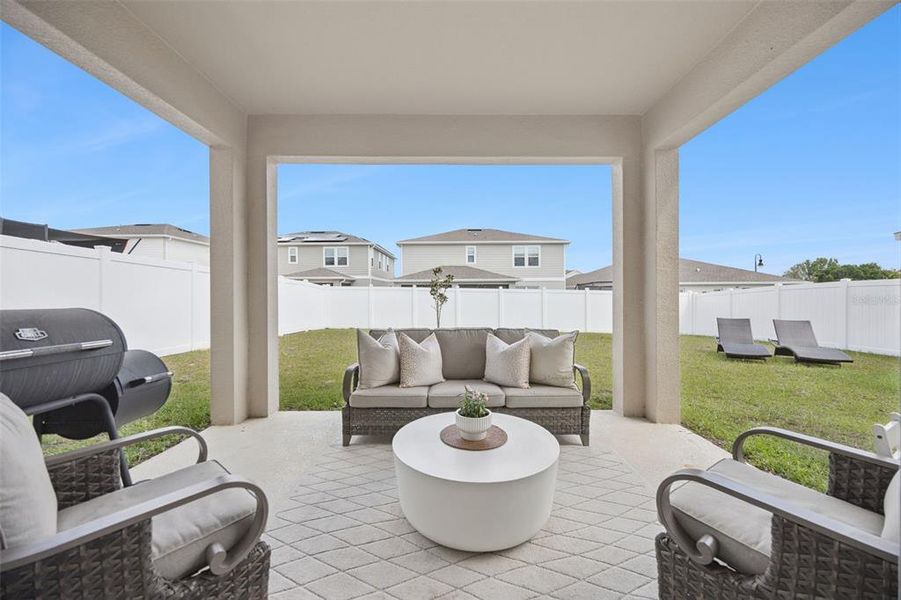 Exterior details and patio area of a home in Seasons at The Grove, Mascotte (Image 19).