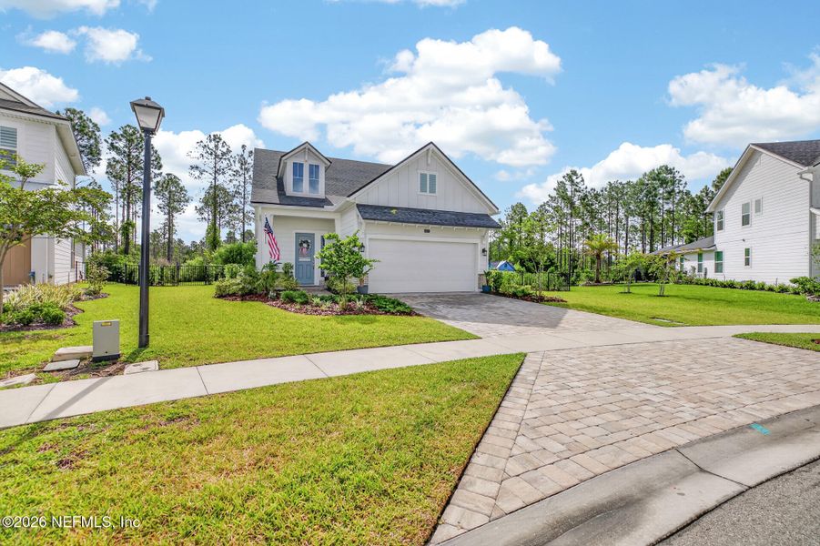 Front exterior of a new home in , Ponte Vedra, FL, highlighting curb appeal (Image 24).