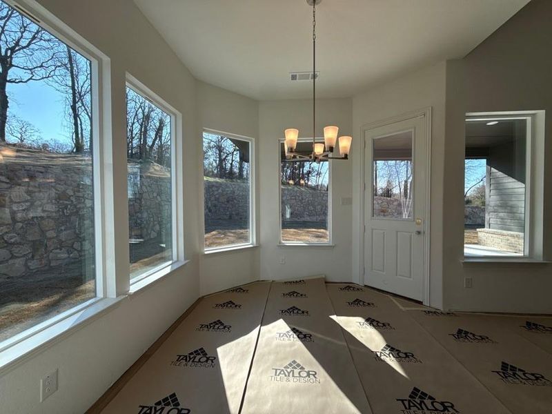 Unfurnished dining area featuring a chandelier