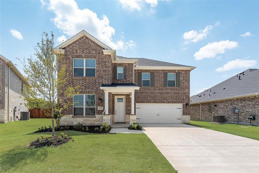 Front exterior of a new home in Walden Pond, Forney, TX, highlighting curb appeal (Image 17). Front exterior of a new home in Walden Pond, Forney, TX, highlighting curb appeal (Image 17).