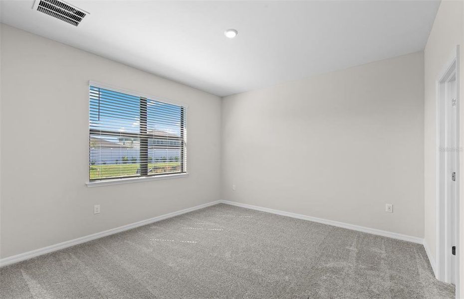 Spacious, unfurnished interior of a new home in The Strand at Cedar Grove, North Port (Image 24).