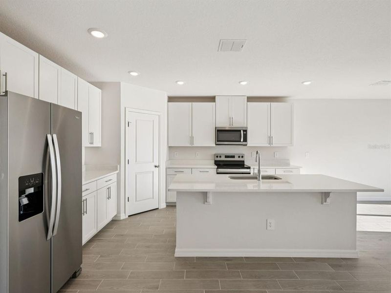 Furnished interior view inside a new home in Oakfield Trails - Classic Series, Parrish (Image 6).