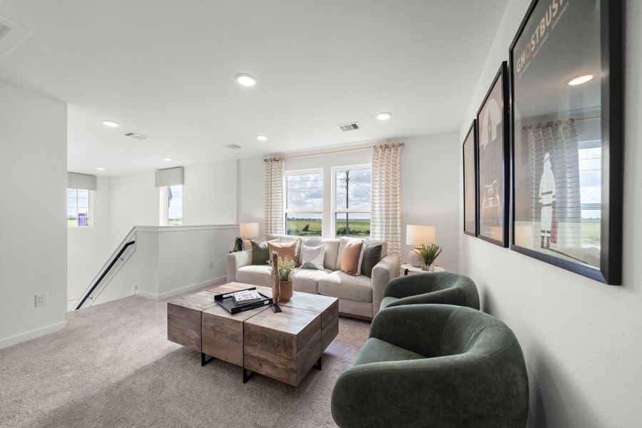 A living room with a large window. A living room with a large window.
