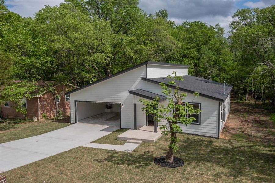 Front exterior of a new home in , Seagoville, TX, highlighting curb appeal (Image 24).