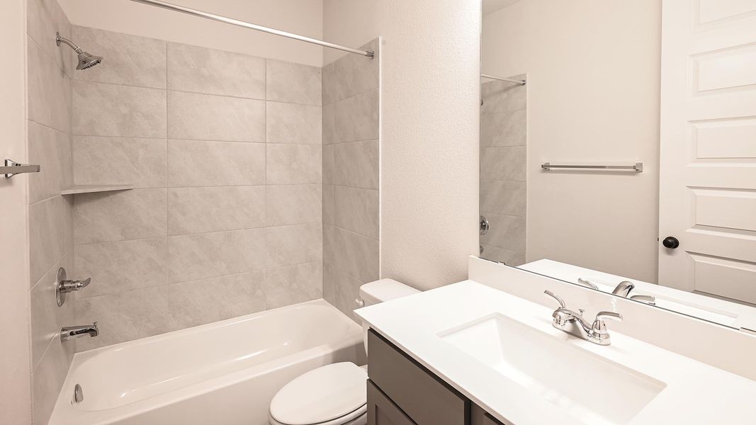 Full bathroom featuring shower / tub combination and vanity