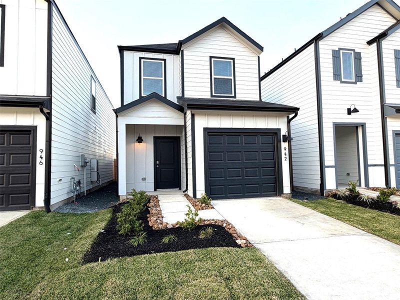 Front exterior of a new home in Legacy Park, Houston, TX, highlighting curb appeal (Image 2). Front exterior of a new home in Legacy Park, Houston, TX, highlighting curb appeal (Image 2).