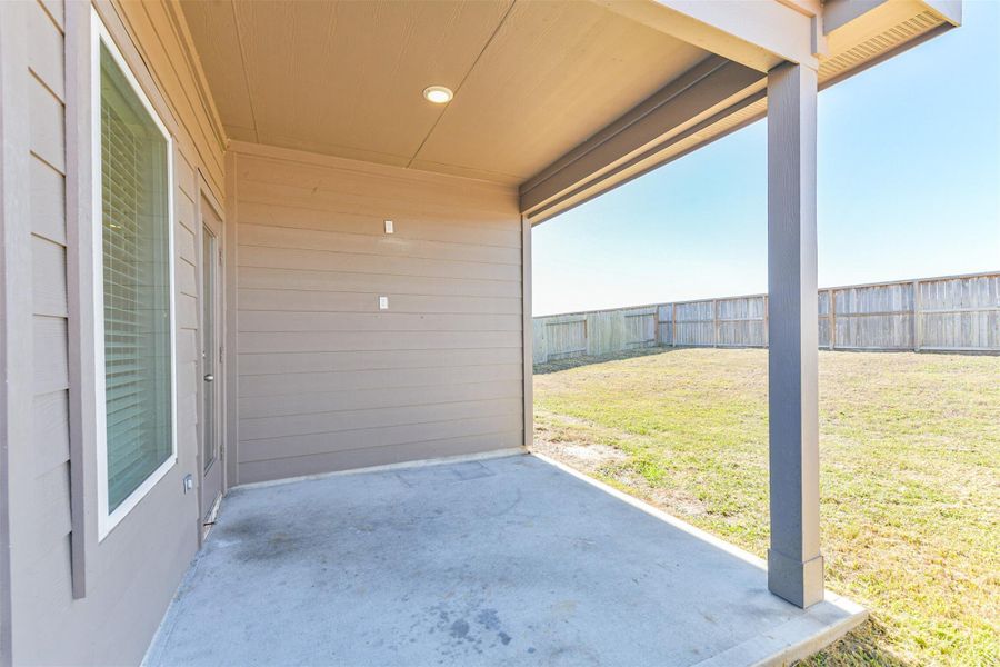 Exterior details and patio area of a home in Harrington Trails at The Canopies, New Caney (Image 3).