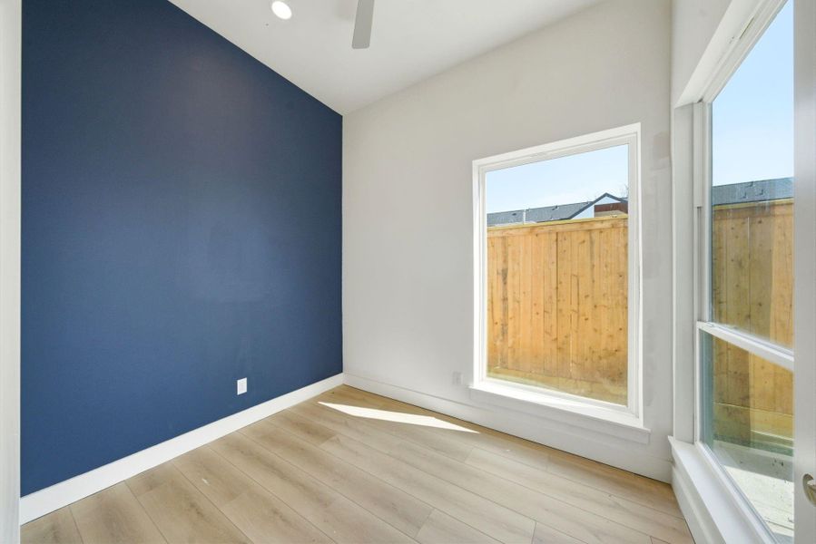 Discover productivity in this inviting 1st-floor office, the perfect fourth room of the house, bathed in natural light and ready for your inspiration.