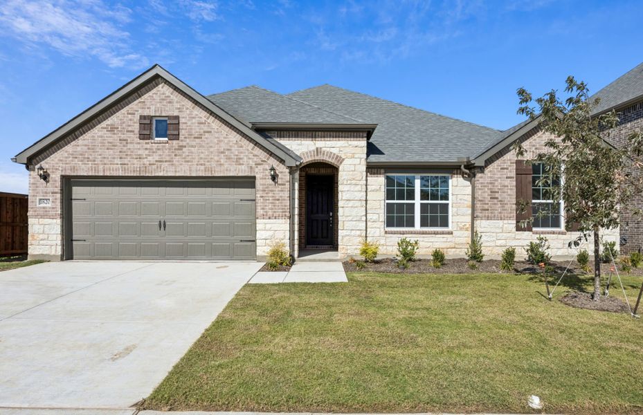 Front exterior of a new home in Wellington, Fort Worth, TX, highlighting curb appeal (Image 1). Front exterior of a new home in Wellington, Fort Worth, TX, highlighting curb appeal (Image 1).